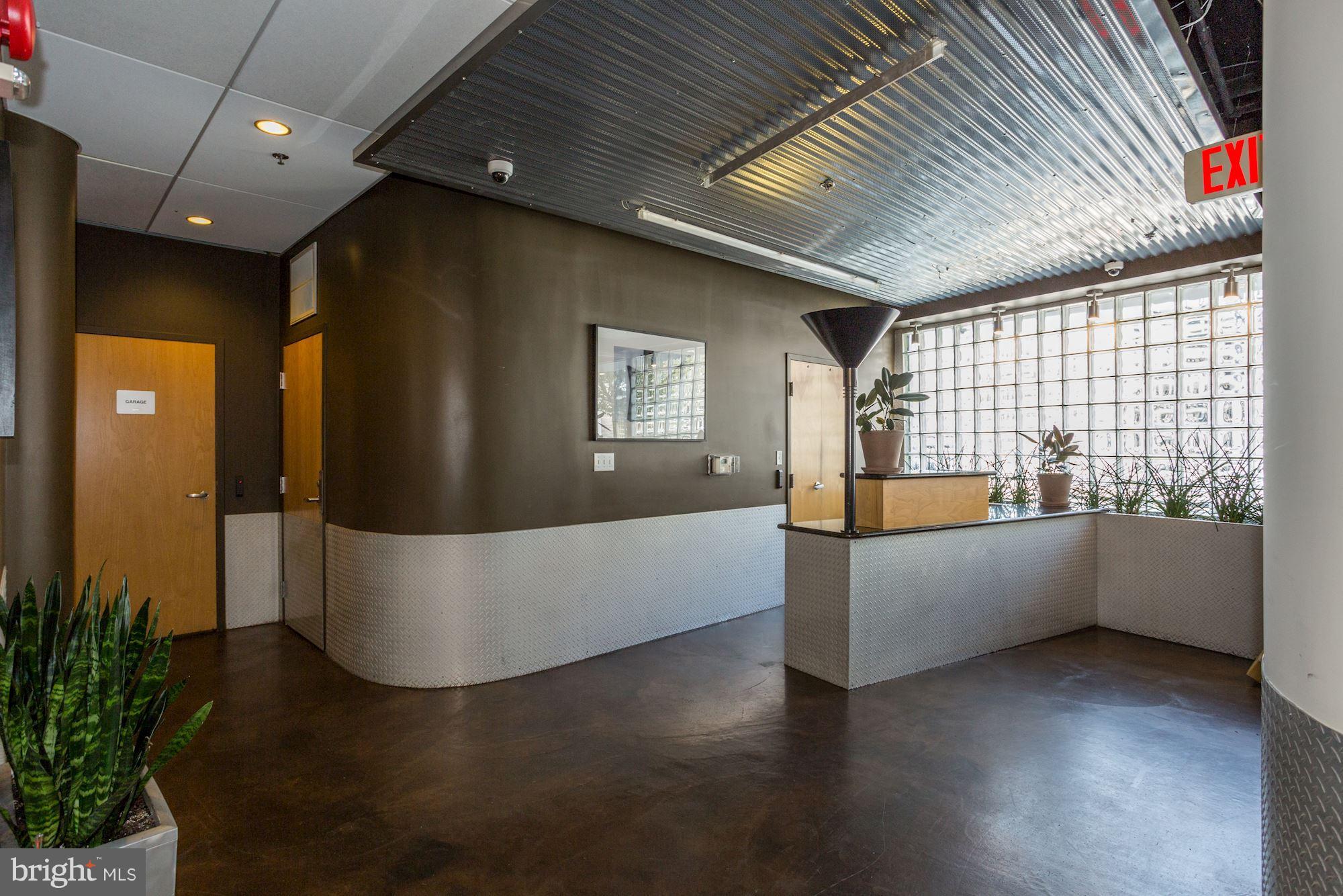 1700 Kalorama Road Northwest, Unit 312 Washington, DC 20009 - Photo 29 of 45 a living room with furniture and large windows