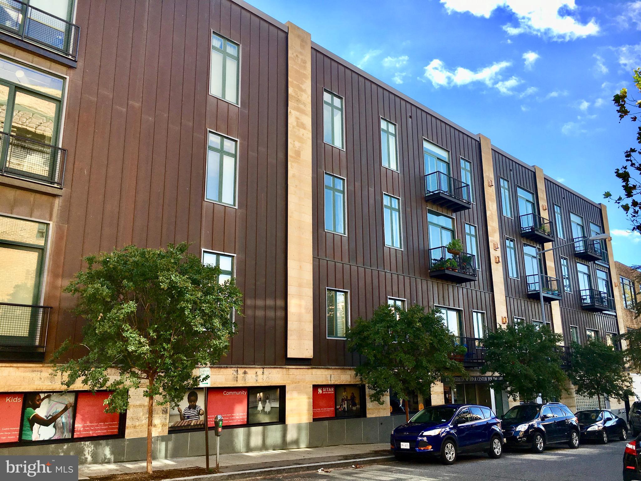 1700 Kalorama Road Northwest, Unit 312 Washington, DC 20009 - Photo 31 of 45 a red car parked in front of a building