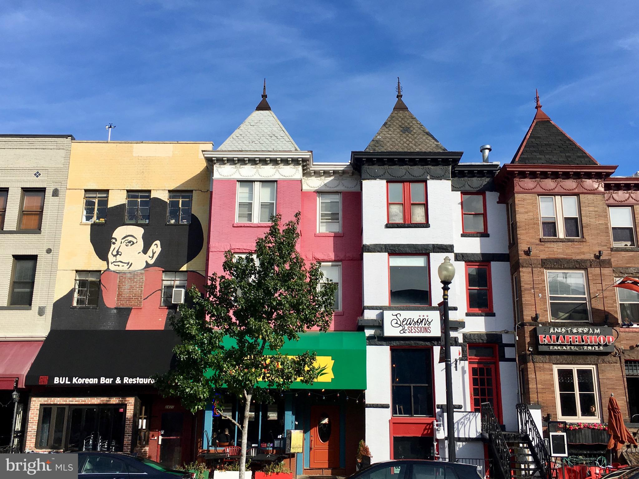 1700 Kalorama Road Northwest, Unit 312 Washington, DC 20009 - Photo 37 of 45 a front view of a multi story residential apartment building with a yard