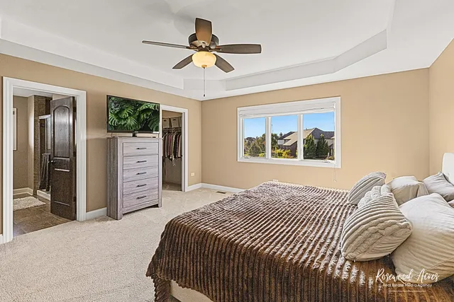 a bathroom with a granite countertop toilet a sink and a mirror
