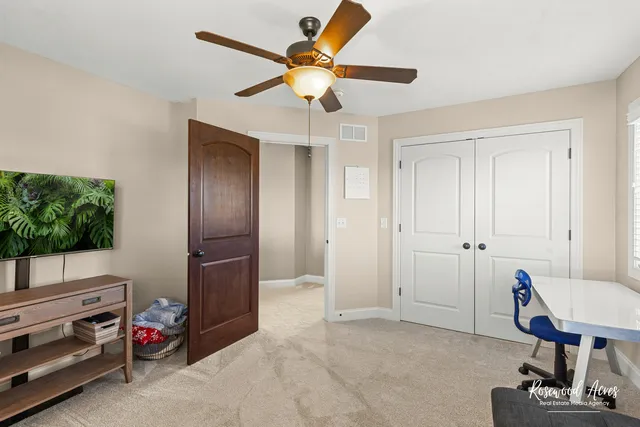 a bedroom with a bed and a cabinets