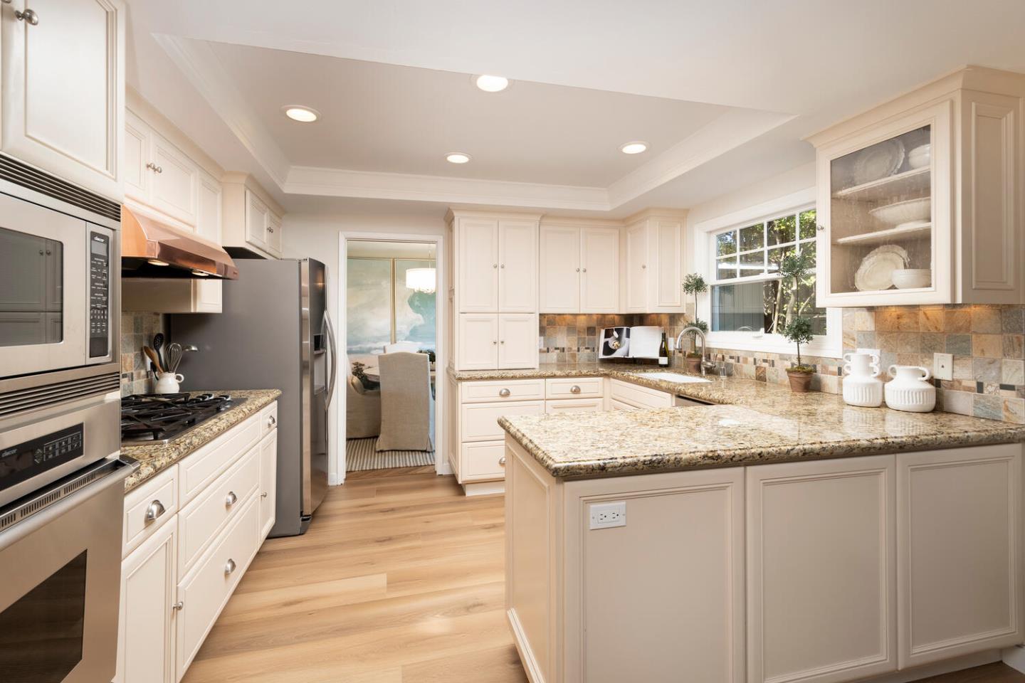 1094 Springfield Drive Millbrae, CA 94030 - Photo 11 of 36 a large kitchen with stainless steel appliances granite countertop a stove a sink and a refrigerator