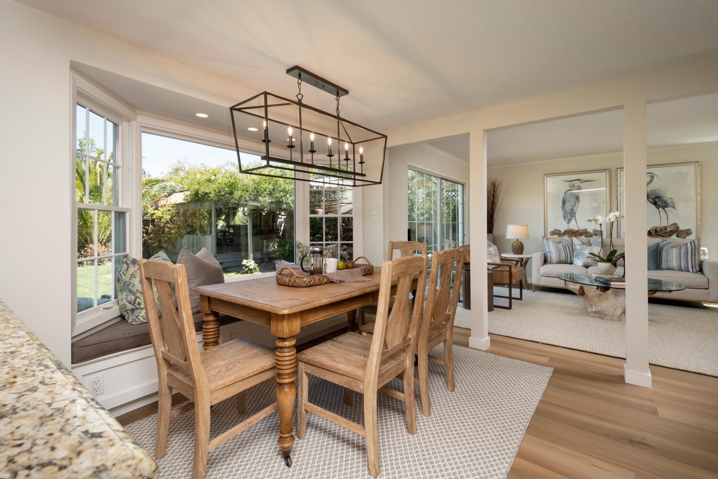 1094 Springfield Drive Millbrae, CA 94030 - Photo 12 of 36 a view of a dining room with furniture wooden floor and chandelier