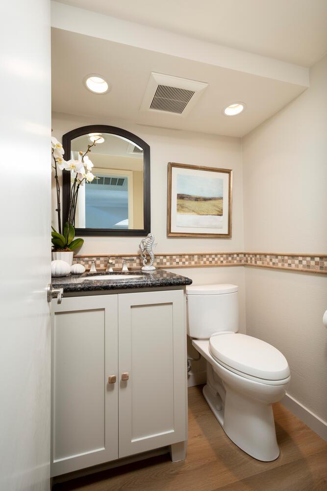 1094 Springfield Drive Millbrae, CA 94030 - Photo 15 of 36 a bathroom with a toilet a sink and mirror
