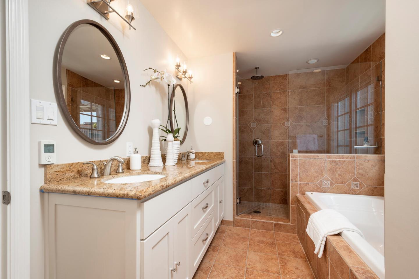 1094 Springfield Drive Millbrae, CA 94030 - Photo 19 of 36 a bathroom with a granite countertop sink a mirror and a shower