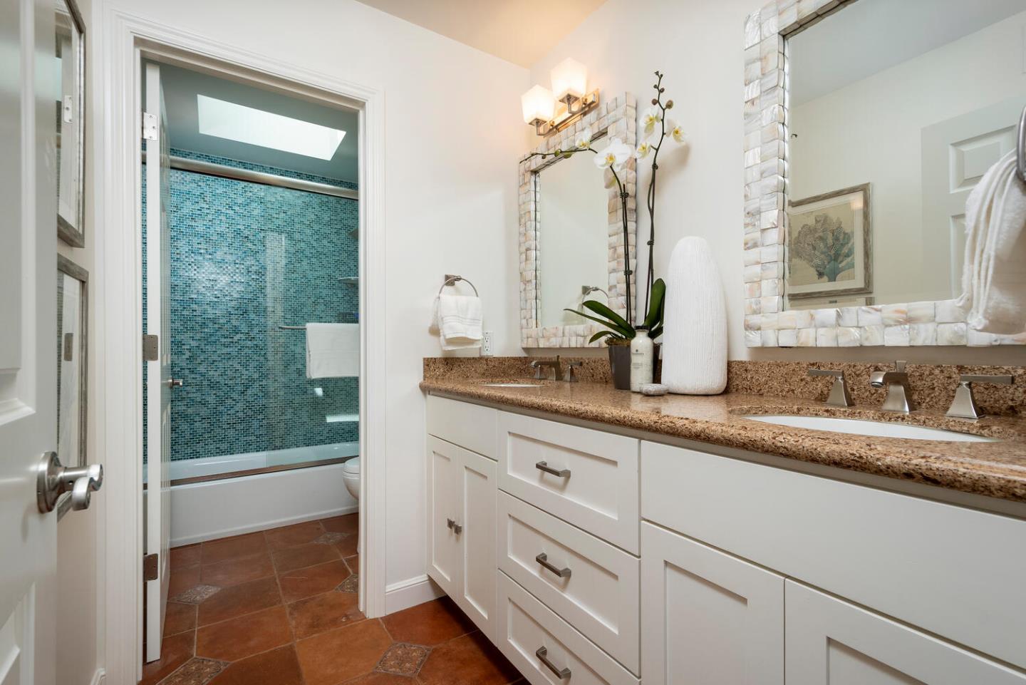 1094 Springfield Drive Millbrae, CA 94030 - Photo 22 of 36 a bathroom with a granite countertop sink mirror and double