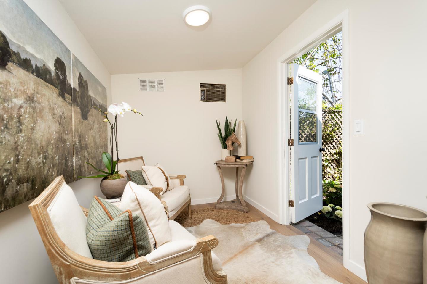 1094 Springfield Drive Millbrae, CA 94030 - Photo 29 of 36 a living room with furniture and a potted plant