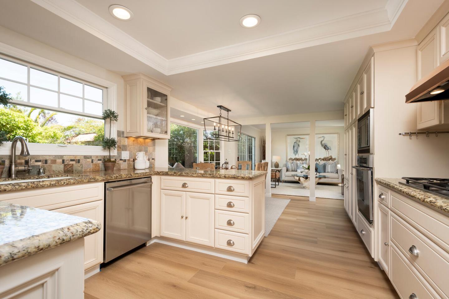 1094 Springfield Drive Millbrae, CA 94030 - Photo 10 of 36 a large kitchen with stainless steel appliances granite countertop a stove and cabinets