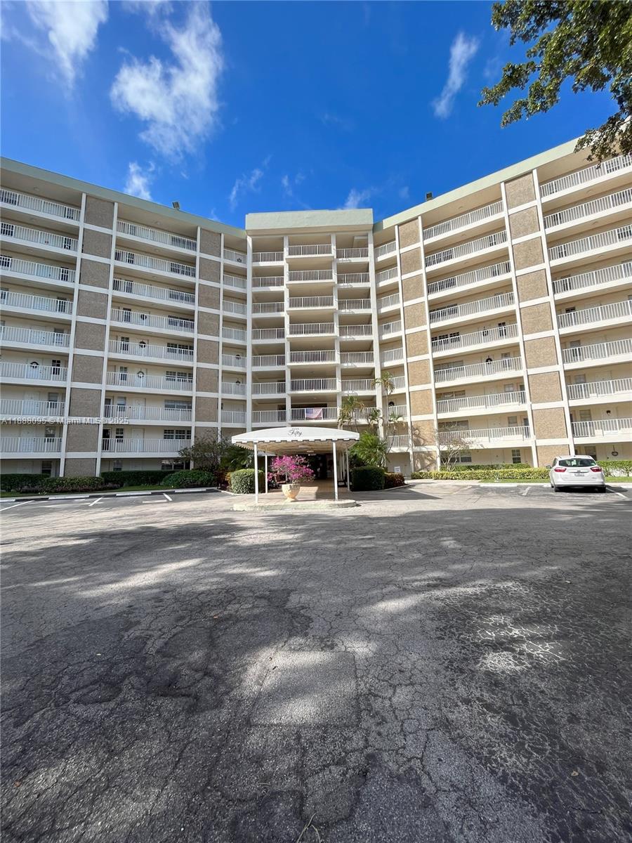 3090 North Course Drive, Unit 304 Pompano Beach, FL 33069 - Photo 16 of 16 a view of a building with a street