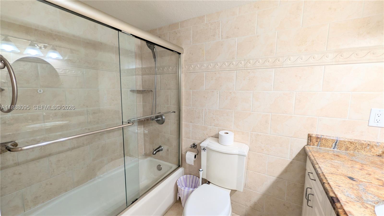 3090 North Course Drive, Unit 304 Pompano Beach, FL 33069 - Photo 5 of 13 a bathroom with a shower and a toilet