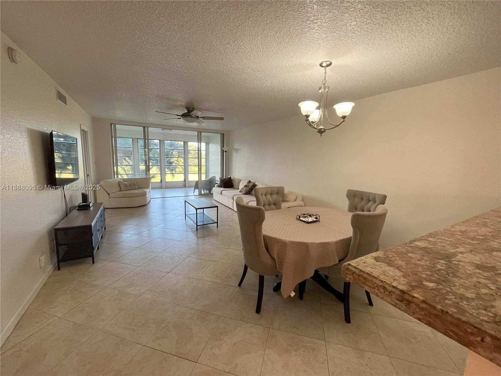 3090 North Course Drive, Unit 304 Pompano Beach, FL 33069 - Photo 6 of 16 a living room with furniture