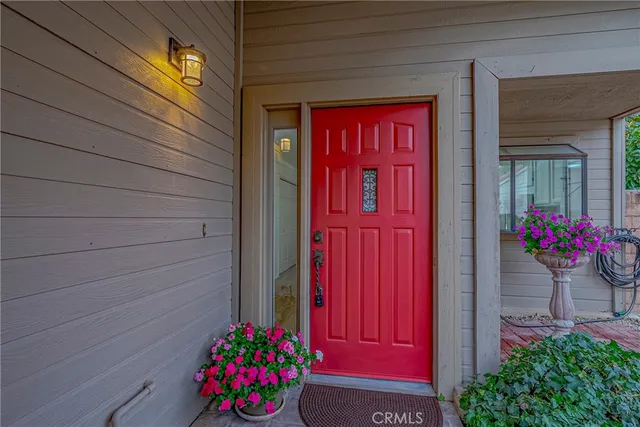 a kitchen with wooden floors and white appliances