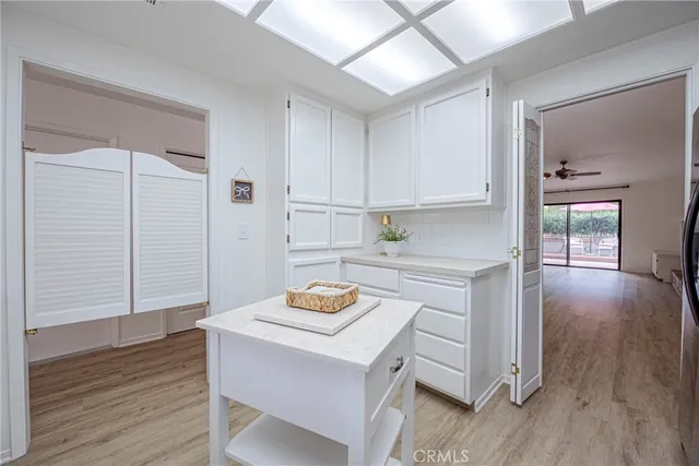 a kitchen with cabinets and appliances