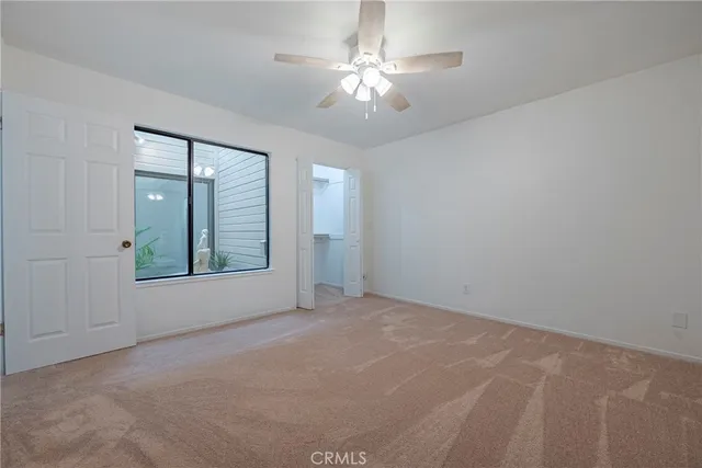 a view of a backyard with sitting area