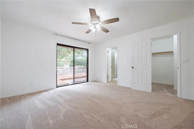 a view of a house with yard and sitting area