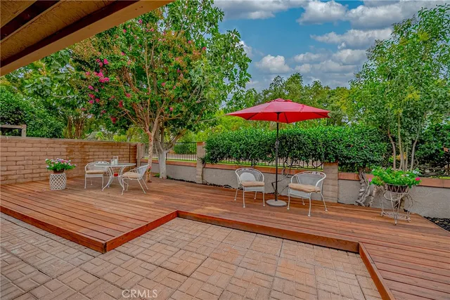 a view of a backyard with sitting area