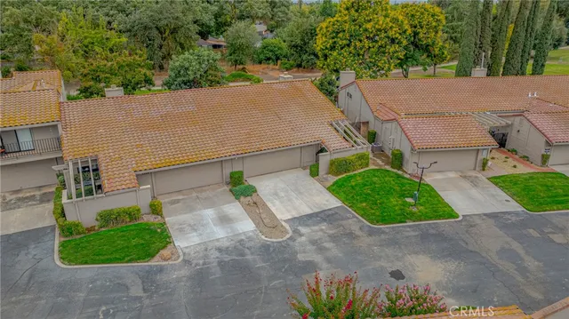 an aerial view of a houses with outdoor space and street view