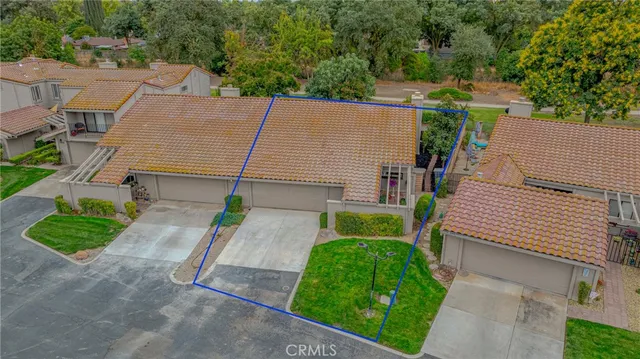 an aerial view of a houses with outdoor space and street view