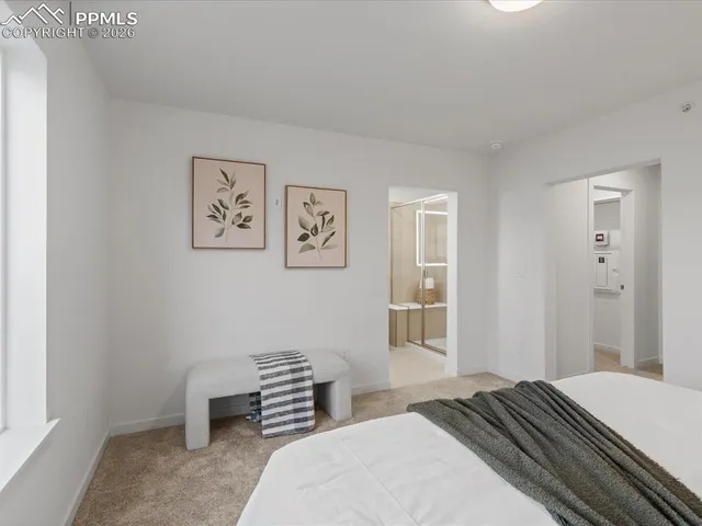 a bedroom with a bed and furniture