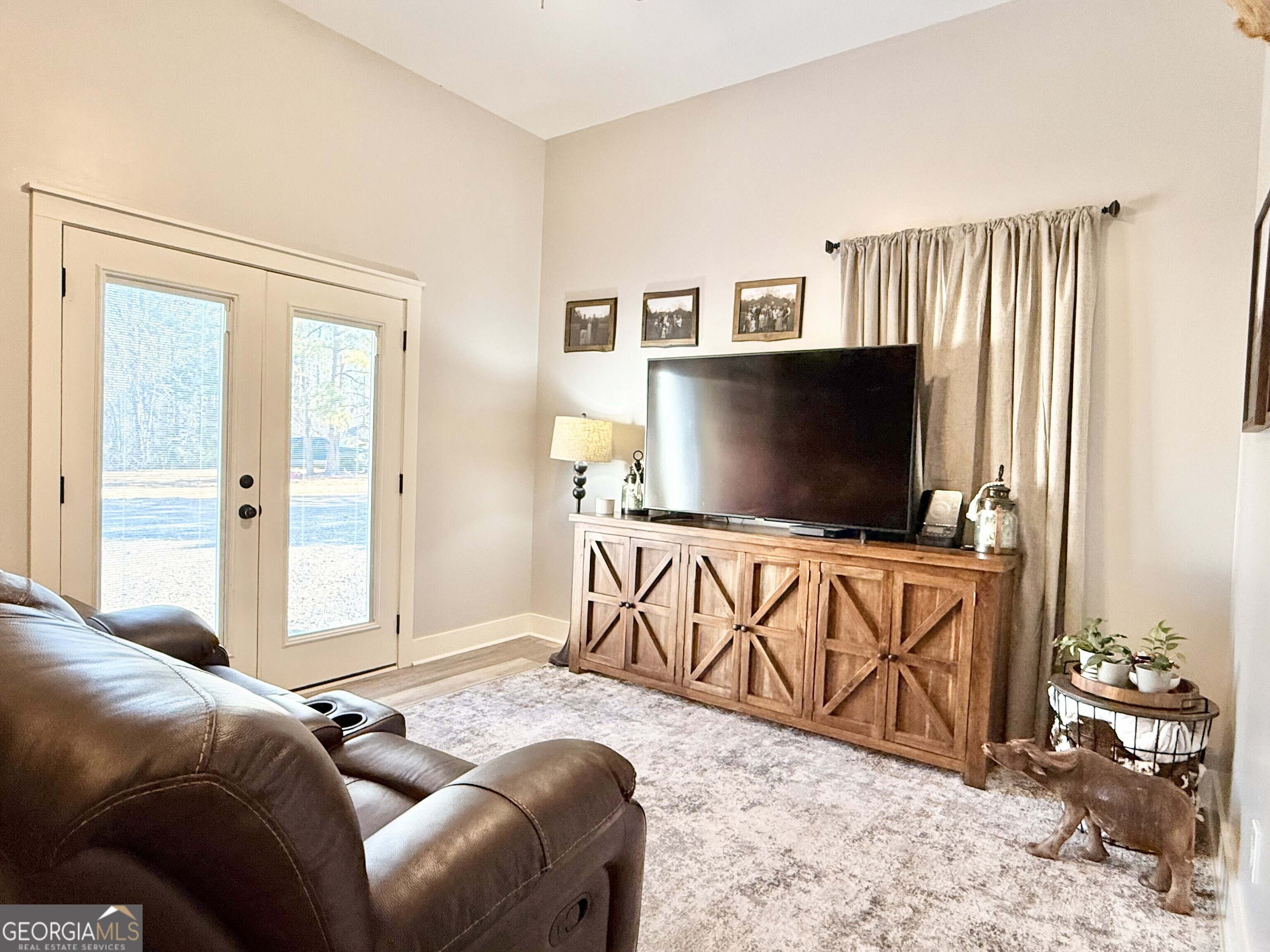 919 West Milner Road Concord, GA 30206 - Photo 40 of 40 a living room with furniture and a flat screen tv