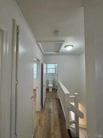 a view of entryway with wooden floor