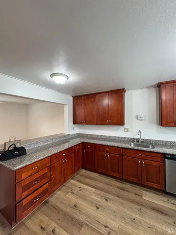 a kitchen with sink and cabinets