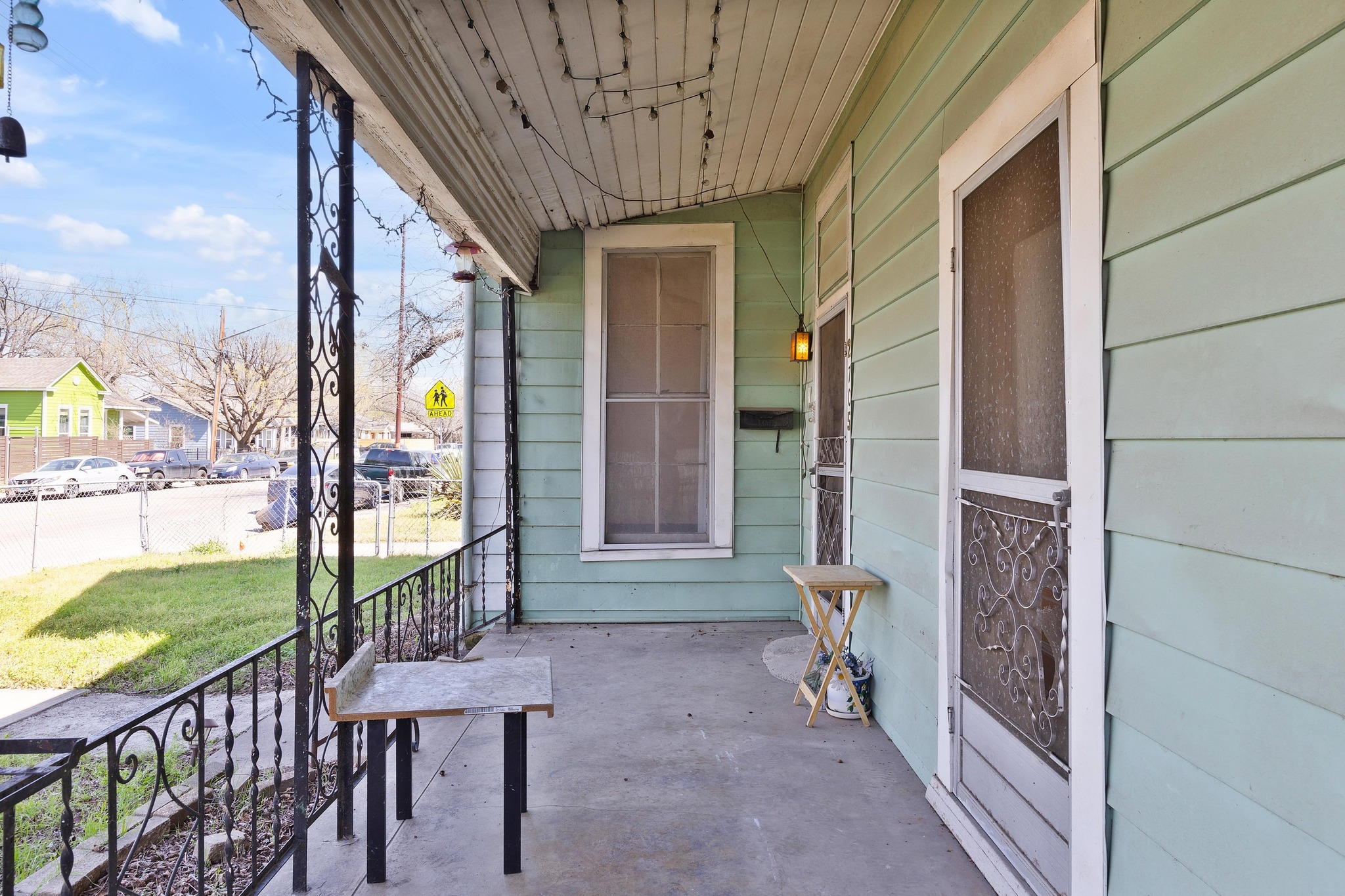 2705 East 2nd Street Austin, TX 78702 - Photo 4 of 36 The large covered front porch is the perfect spot to sip your morning coffee while watching the neighborhood come to life