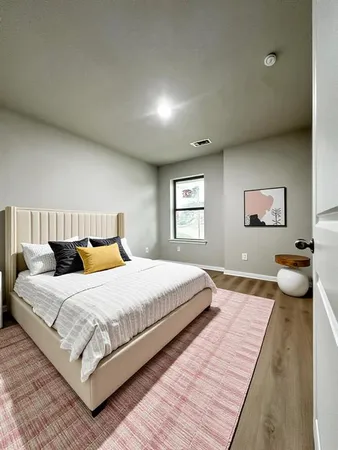 a bedroom with a bed and a couch