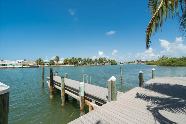 a view of a chairs and table in patio