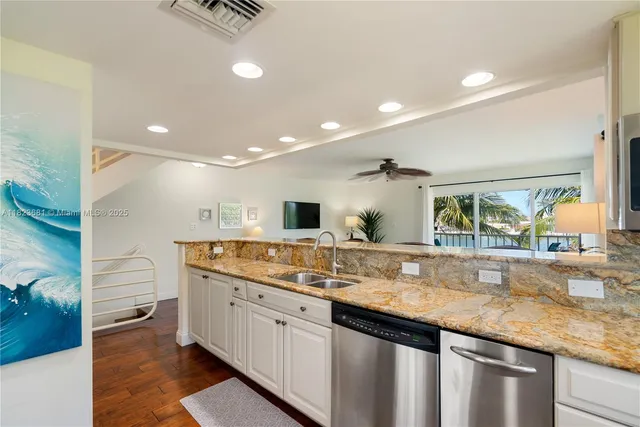 a view of a balcony with furniture and floor to ceiling windows