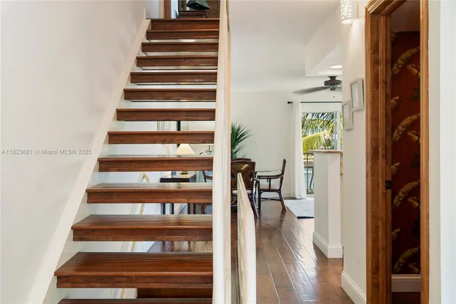 a bathroom with a granite countertop toilet sink and mirror