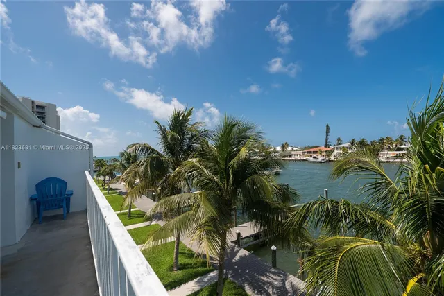 a large bedroom with a bed and a flat screen tv