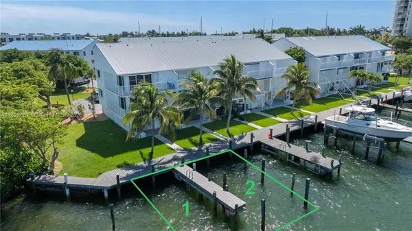 an aerial view of a house with a lake view