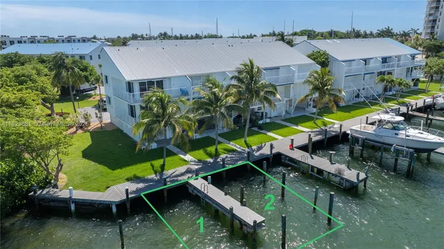 an aerial view of a house with a lake view