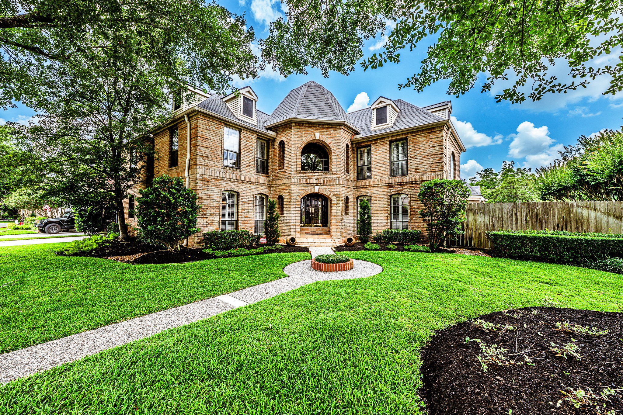 6047 Spring Creek Lane Spring, TX 77379 - Photo 1 of 50
A timeless façade framed by manicured grounds and stately architecture sets the tone from the moment you arrive. With its grand symmetry and old world influence, the home carries a presence that feels both distinguished and welcoming