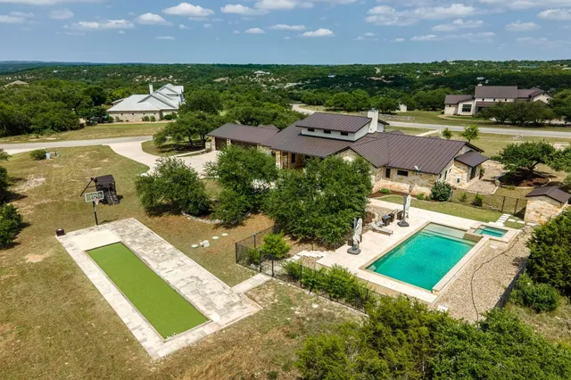 an aerial view of a house with a garden