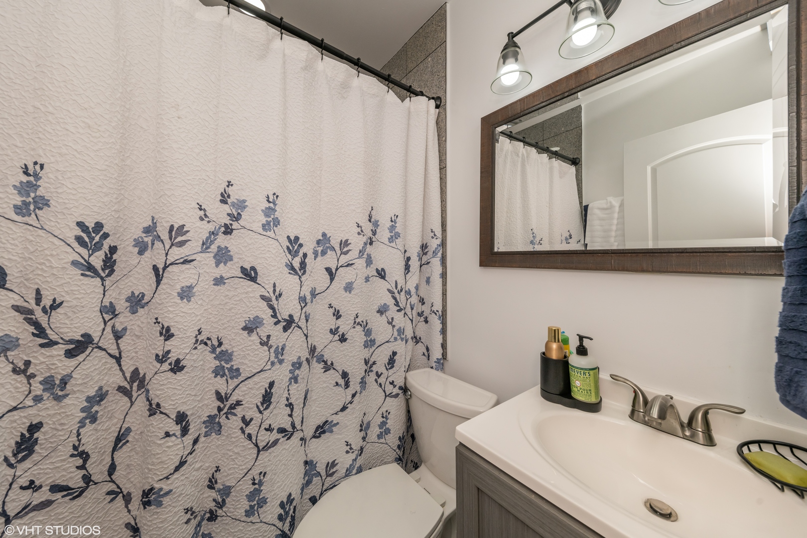 2009 West 17th Street, Unit 1F Chicago, IL 60608 - Photo 8 of 9 a bathroom with a sink toilet and shower