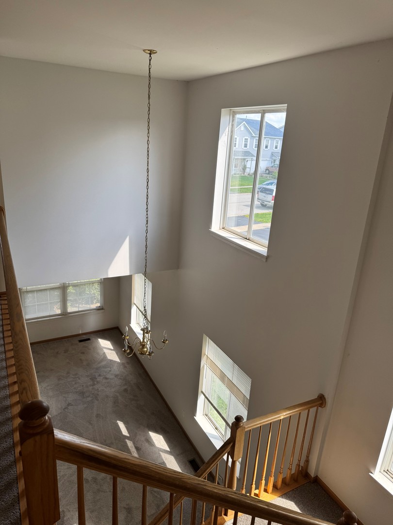 674 Shannon Drive, Unit 674 Romeoville, IL 60446 - Photo 4 of 13 a view of an empty room and window