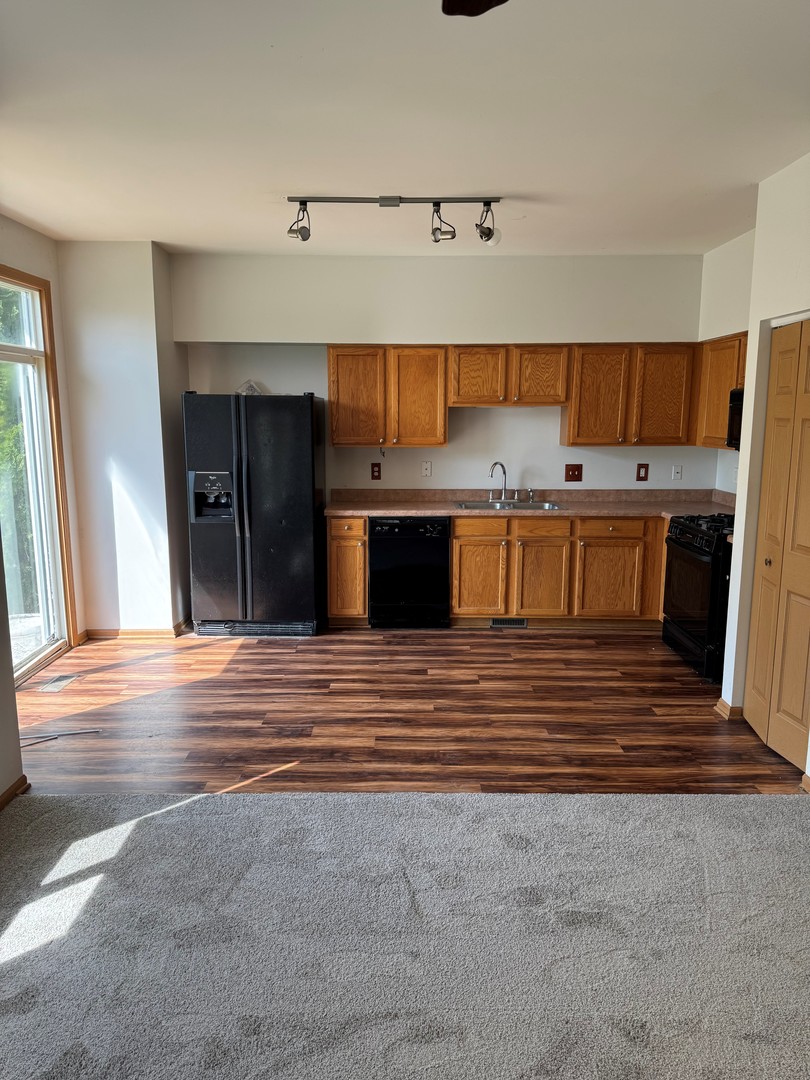 674 Shannon Drive, Unit 674 Romeoville, IL 60446 - Photo 7 of 13 a view of a kitchen with a sink