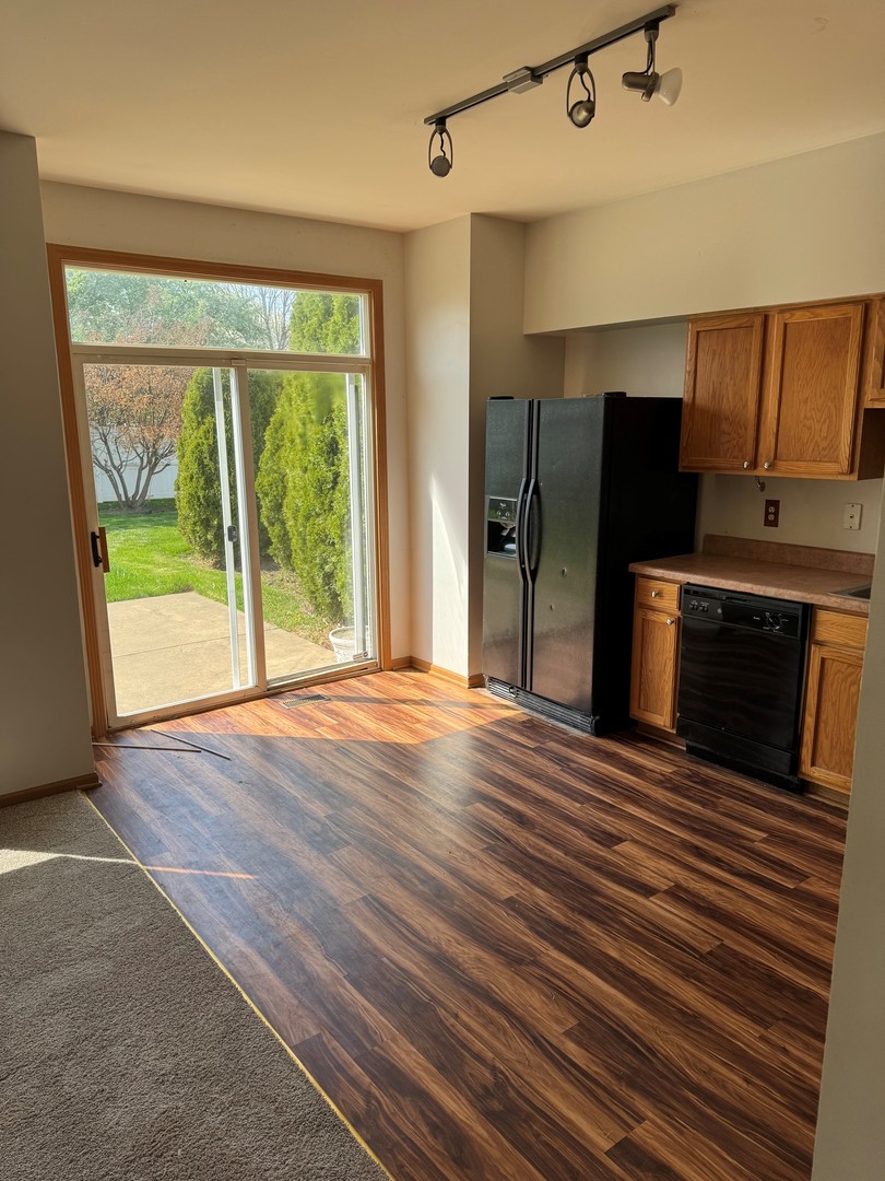 674 Shannon Drive, Unit 674 Romeoville, IL 60446 - Photo 8 of 13 a view of a kitchen with a sink and a fireplace