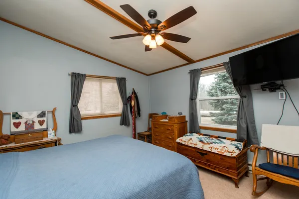 a bedroom with furniture and a window