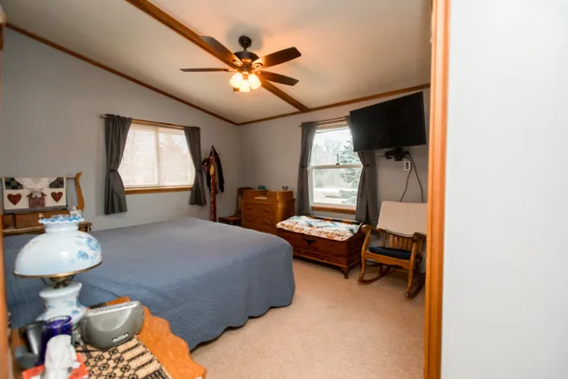 a bedroom with furniture and a window