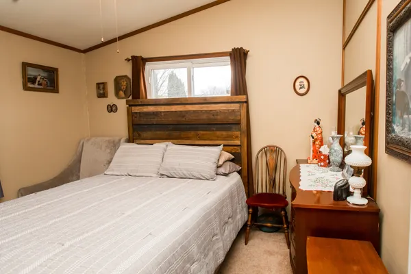 a bedroom with a bed and a table