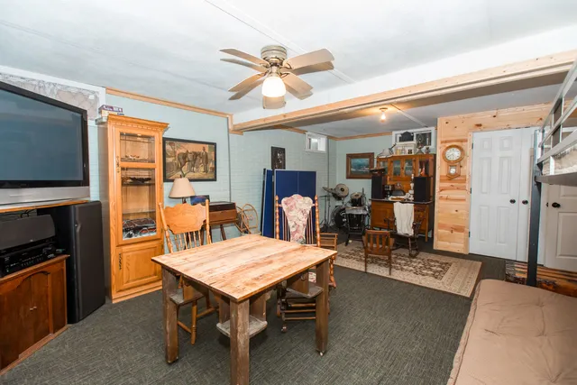 a dining room with furniture and window