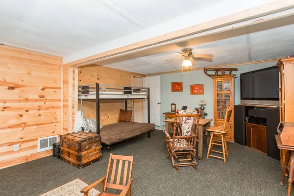 a bedroom with furniture and a window
