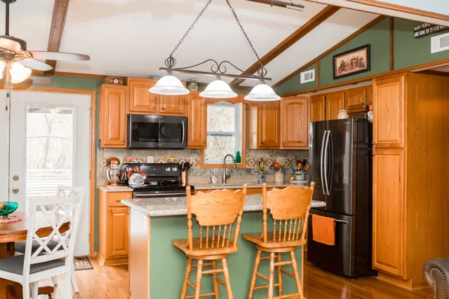 a dining table chair next to a window