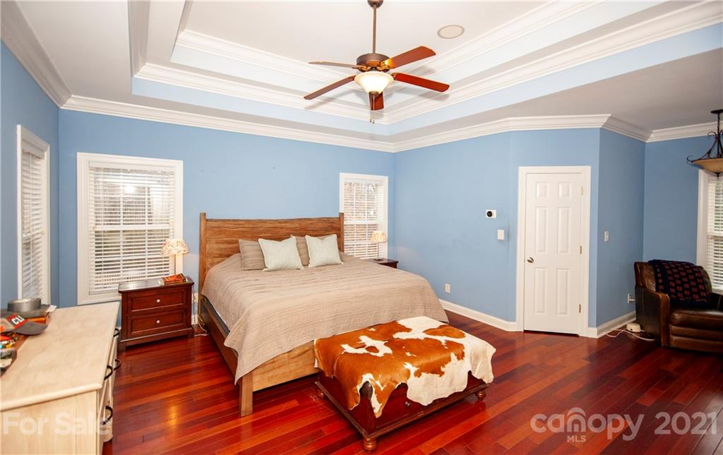 3334 Millstone Creek Road Lancaster, SC 29720 - Photo 8 of 17 a bedroom with a bed and wooden floor