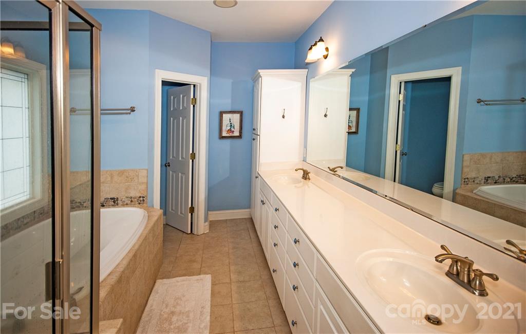 3334 Millstone Creek Road Lancaster, SC 29720 - Photo 9 of 17 a spacious bathroom with a tub sink and mirror