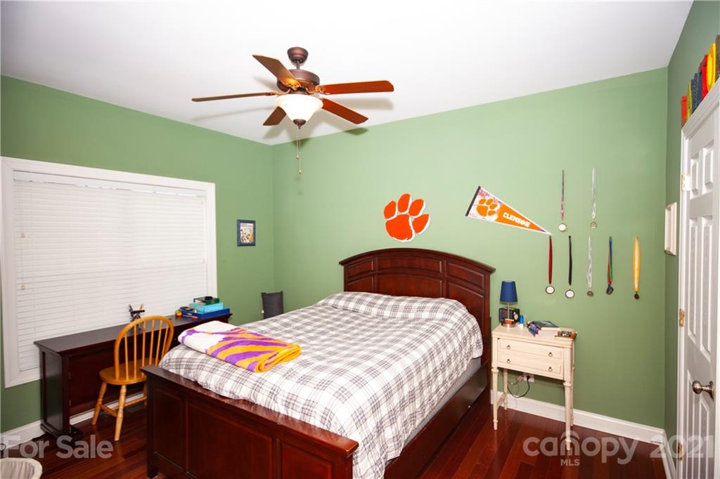 3334 Millstone Creek Road Lancaster, SC 29720 - Photo 10 of 17 a bedroom with a bed and a chandelier