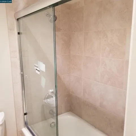 a kitchen with a window a sink and a stove